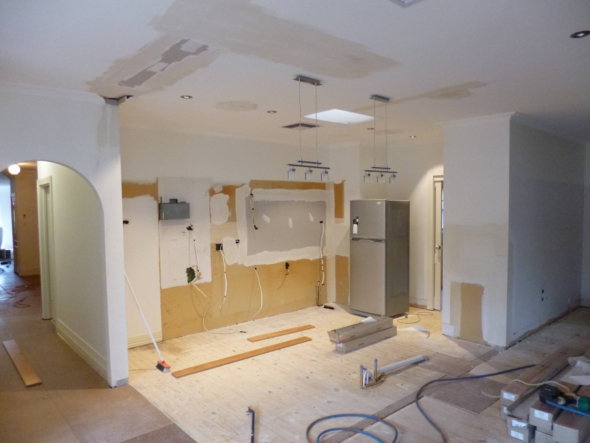 Existing kitchen has been demolished, all electrical wiring and plumbing installed for the new cabinet layout and plaster has been patched ready for the new kitchen.