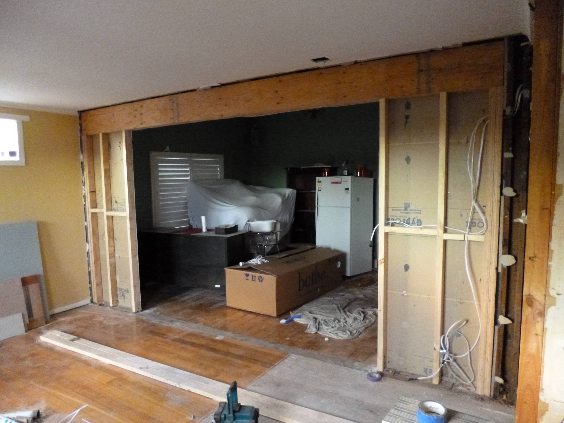Installation of timber lintel for a larger opening between the lounge and kitchen areas.