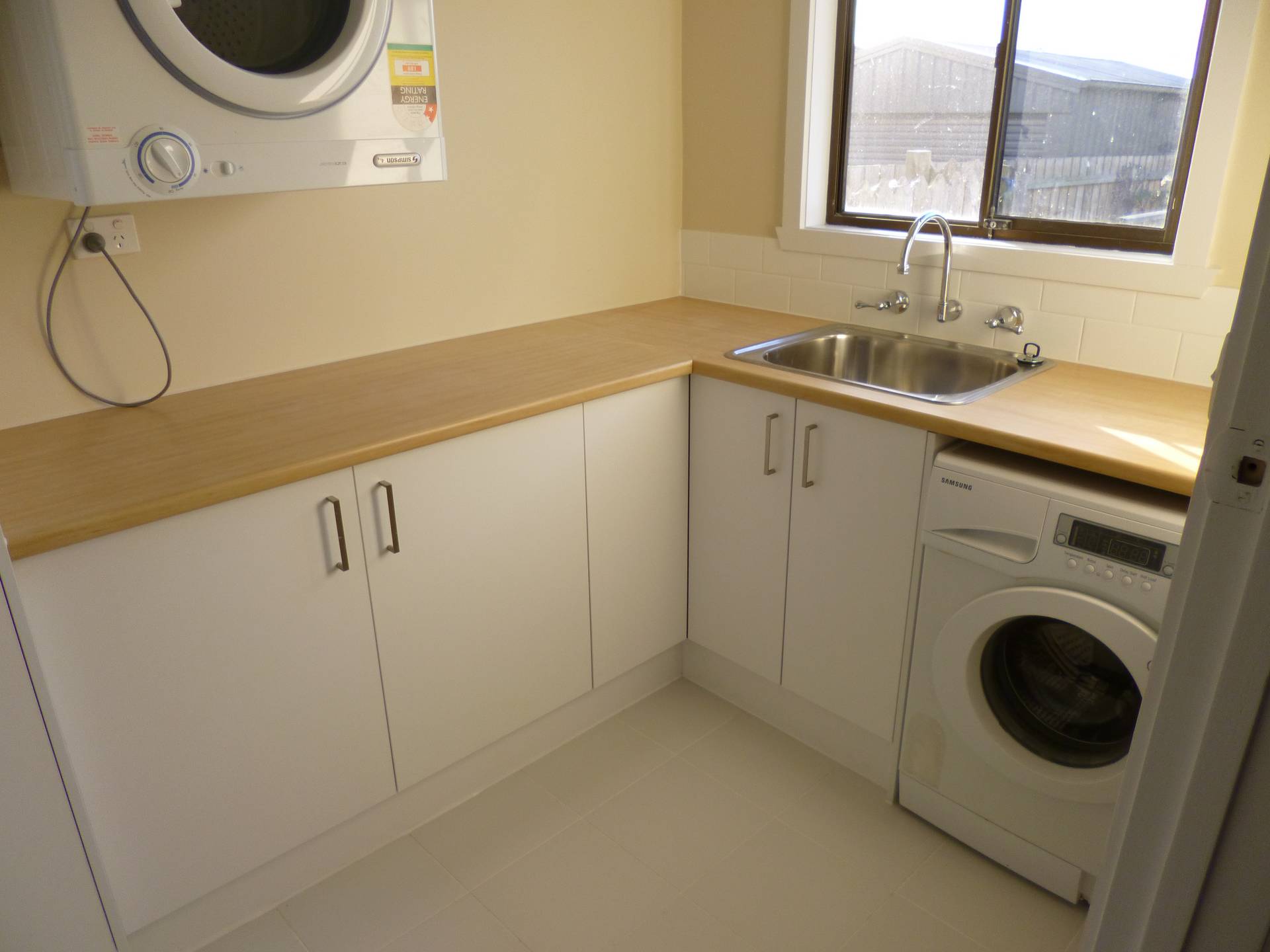 Laundry renovation with new floor tiles