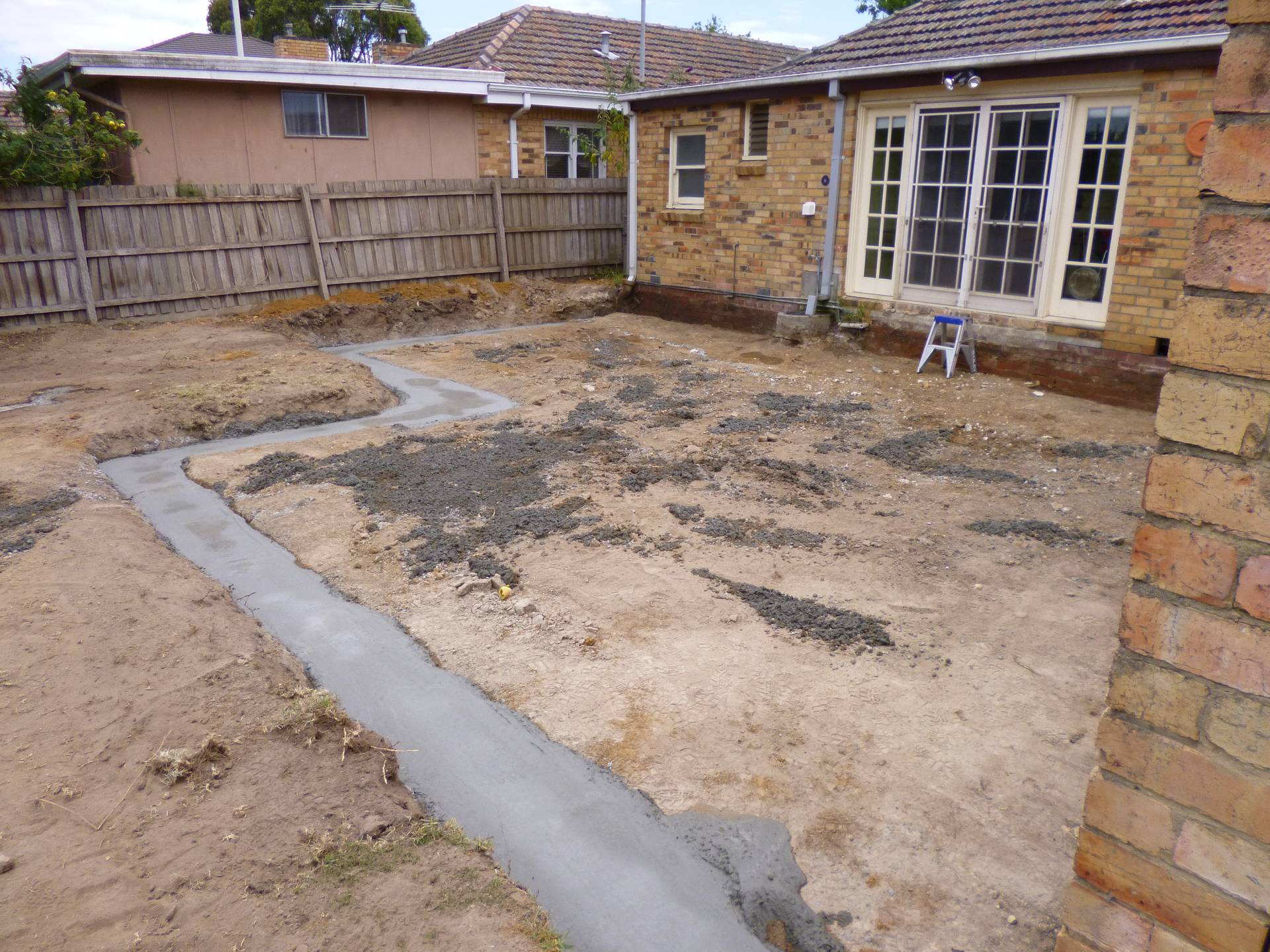 Excavation, and strip footings have been poured.