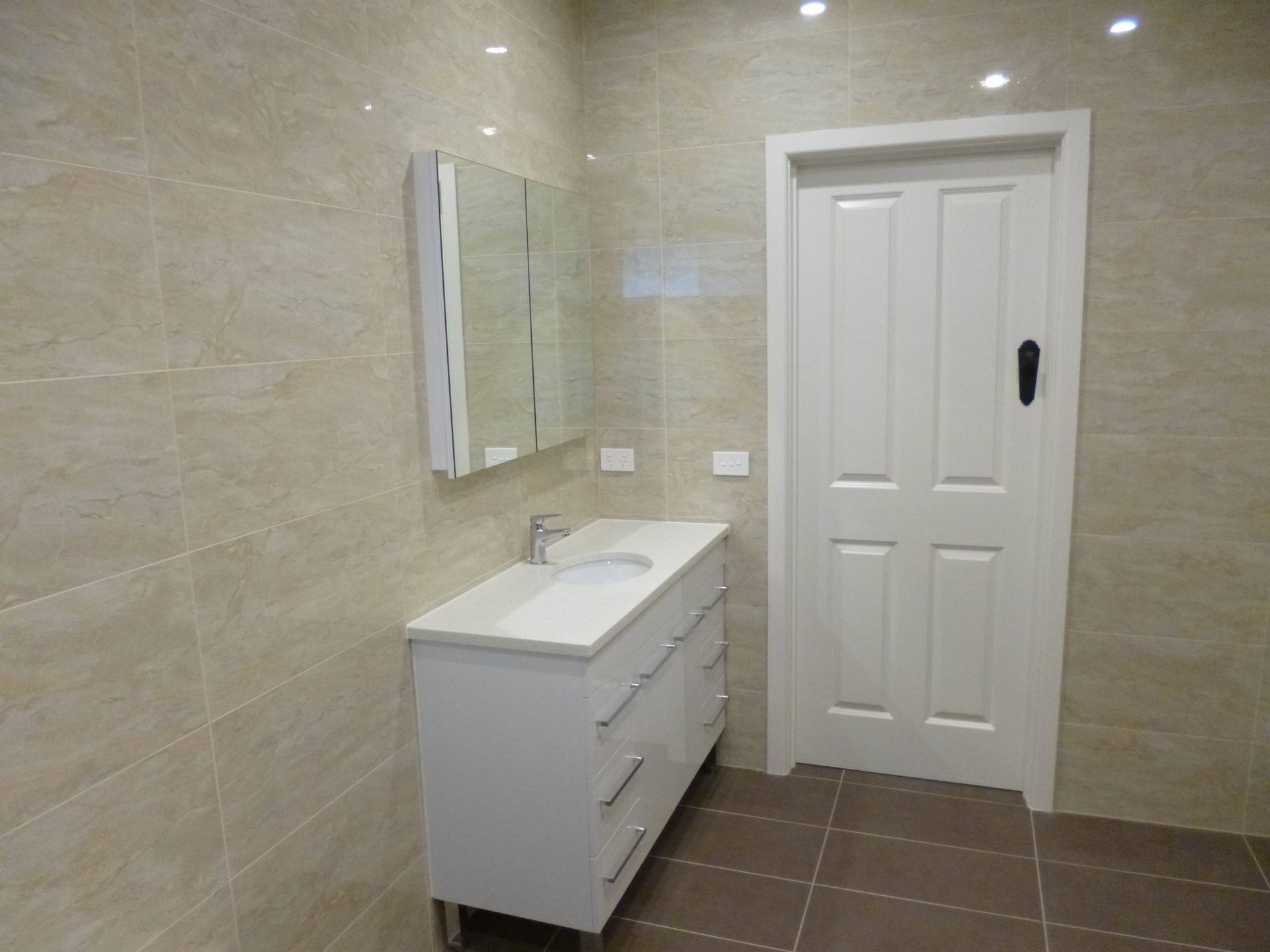Bathroom vanity and shaving cabinet.